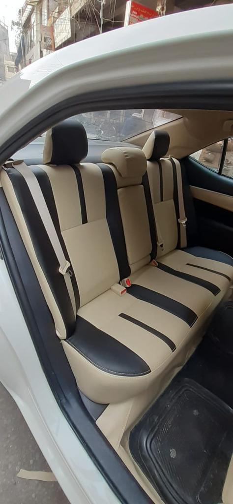 Beige and black rear bench upholstery